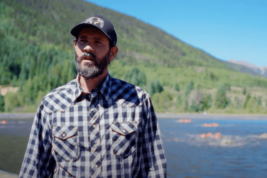 Man in front of wastewater treatment facility outside